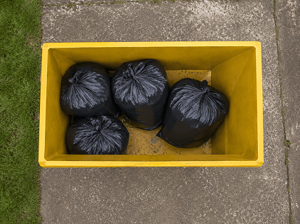 Skip bin load showing heavy material such as soil or rubble