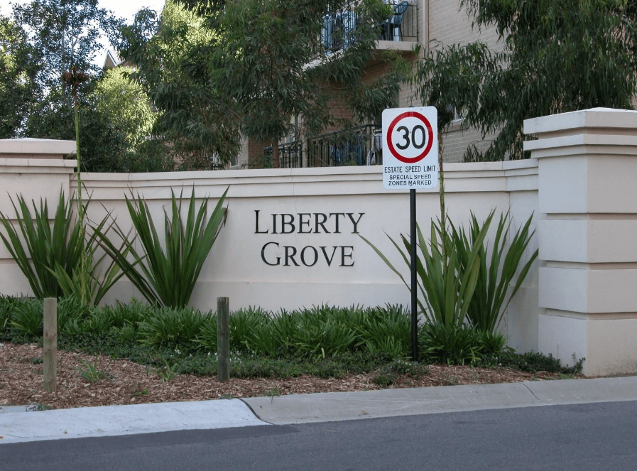 Liberty Grove estate entrance sign with landscaping